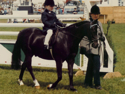 joyce newby leading jacky newbery on a lead rain pony 